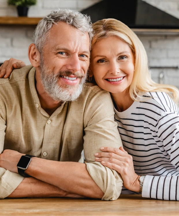 Couple discussing dental implant treatment